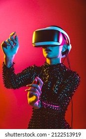 Modern beauty portrait. Young woman with shaved head and virtual reality visor glasses