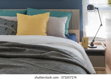 Modern Bedroom With Colorful Pillows On Bed