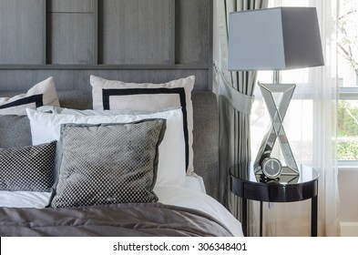 Modern Bedroom Design In Black And White Color Scheme With Modern Lamp On Side Table