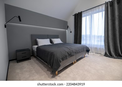 Modern bedroom interior decorated in the minimalist style - Powered by Shutterstock