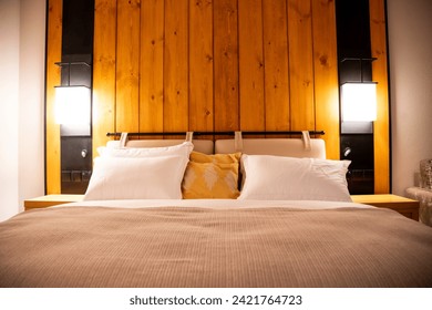 Modern bedroom in Nathiagali, Pakistan, offering stunning mountain views. Ideal hotel accommodation with contemporary design as well as furniture in a five-star hotel room showing two beds  - Powered by Shutterstock