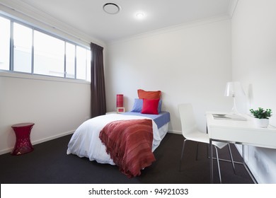 Modern Bedroom With Single Bed, Table And Chair