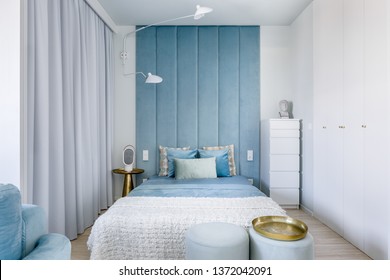 Modern Bedroom With Upholstered Wall Panels And Double Bed