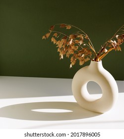 Modern Beige Ceramic Vase With Dry  Grass And Sunlight Shadow On White  Table Near Green Wall.Copy Space,  Scandinavian Interior. 