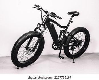 Modern black bicycle with thick wheels and an electric motor. - Shutterstock ID 2237785197