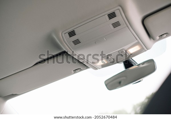 Modern\
black car interior, case for glasses in the\
car