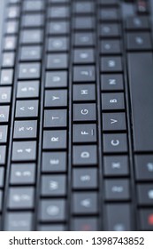 Modern black computer keyboard with flat keys.