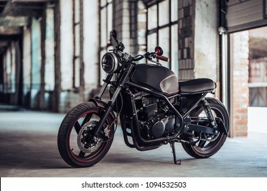 Modern Black Motorcycle In Garage. Cafe Racer.