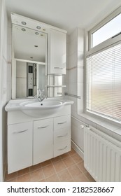 Modern Black Shower Column In Expensive Open Bathroom With White Tiled Wall And Window