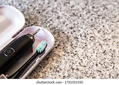 Modern Black Sonic Or Electric Toothbrush In Case On Flat Lay Background With Copy Space. Concept Of Professional Oral Care And Healthy Teeth By Using Ultrasonic Toothbrush