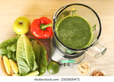 Modern blender with smoothie and ingredients on light wooden table, top view - Powered by Shutterstock