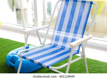Modern blue beach chair - Shutterstock ID 401124049