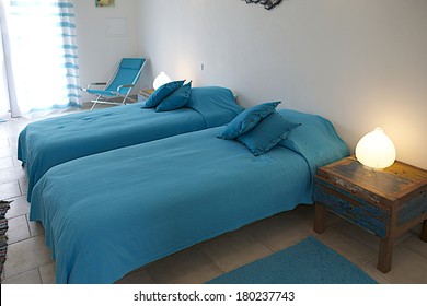 Modern Blue Bedroom Interior In A Luxury House With Reclaimed Wood Bedside Tables 