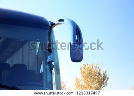 Modern blue bus against sky. Passenger transportation