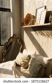 Modern Boho Style Home Interior Design. Bohemian Bedroom. Warm Sunlight Shadows On The Wall. Hygge Concept.