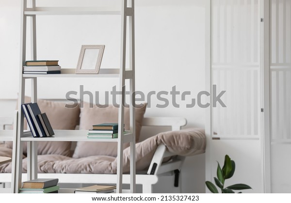Modern bookcase with\
frame in living room