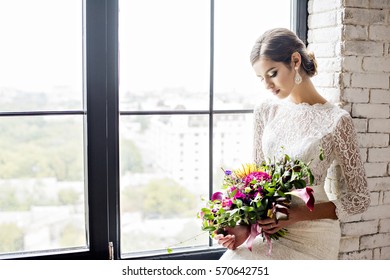 Modern Bride In Vintage Dress With A Wedding Bouquet In Hands