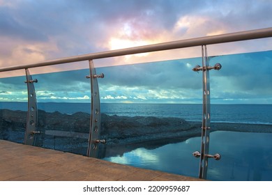 Modern Bridge Construction Detail Made By Steel And Glass On The Beach With Cloudy Sky Background