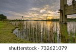 Modern bridge with nice reflection during sunset in Putrajaya Malaysia. Soft focus due to long exposure shot.
