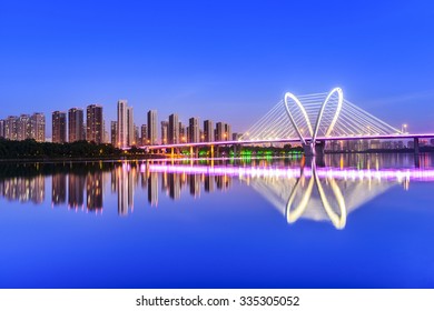 Modern Bridge  And Skyscraper At Dusk. Located In Shenyang City, Liaoning Province, China.