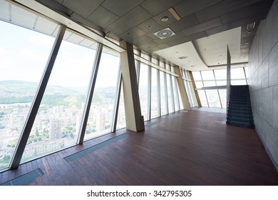 Modern Bright Empty Office Or Living Room  Interior With Big Windows And Stairs