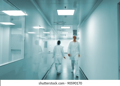 Modern Bright Factory Interior With Working People In Motion