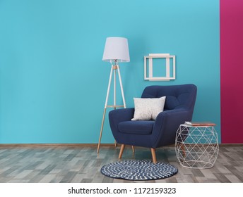 Modern bright interior with comfortable blue armchair - Shutterstock ID 1172159323