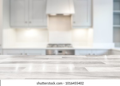 Modern bright kitchen with a white wooden countertop - Shutterstock ID 1016455402