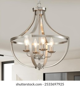 A modern brushed nickel chandelier with five exposed bulbs, hanging in a contemporary living space with neutral tones.