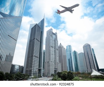 Modern Building With Airplane Under The Sky In Shanghai