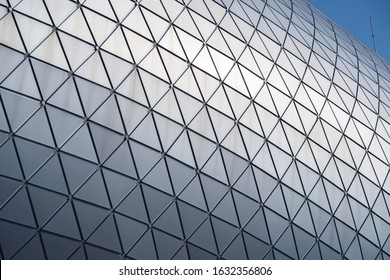 Modern Building With Curving Roof And Glass Steel Column, Building Structures Aluminum Triangle Geometry On Facade Of Modern Urban Architecture