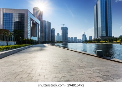 Modern Building Exterior With Brick Road Floor At Riverbank