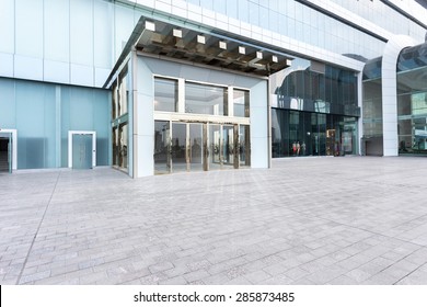 Modern Building Facade With Empty Cement Road For Copy Space.