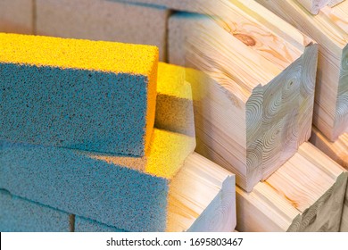 Modern building material. Ordering goods with delivery to the construction site. Aerated concrete blocks and wooden bars. Construction of the walls of the future house. - Shutterstock ID 1695803467