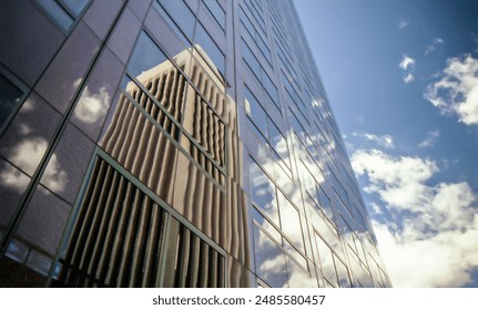 A modern building reflected in another building