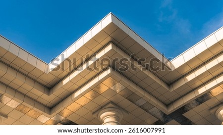 Modern Building with Sleek Ceiling and Classical Columns