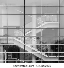 Modern Building Staircase Viewed Through The Glass Wall