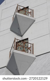 Modern building with triangular balconies and decorative railings