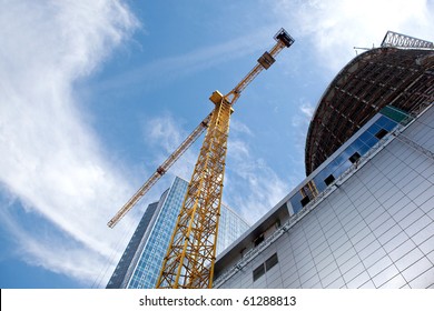 Modern Building Under Construction Against Blue Sky