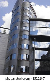 Modern building with windows clouds in the background