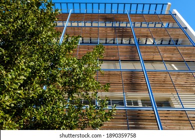 Modern Building With Wooden Boards On The Facade To Protect From The Sun And Be Of Sustainable Construction.