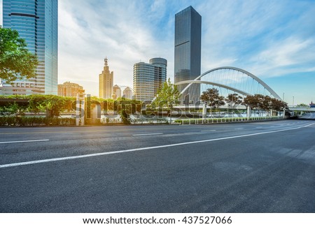 modern buildings with empty road under blue sky,tianjin china.