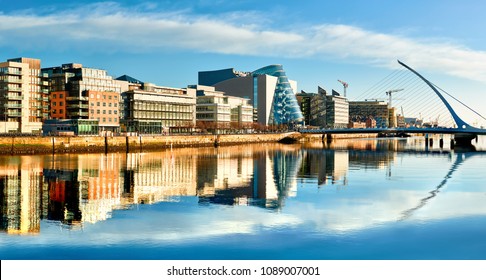 Modern buildings and offices on Liffey river in Dublin on a bright sunny day