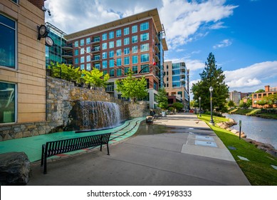 Modern buildings and walkway along the Reedy River, in downtown Greenville, South Carolina.