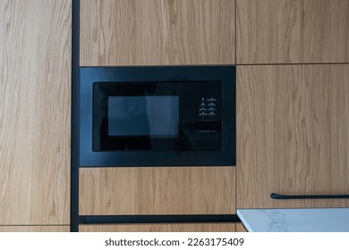 Modern built in microwave oven in the kitchen