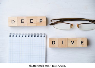 Modern Business Buzzword - Deep Dive. Top View On Wooden Table With Blocks. Top View. Close Up.