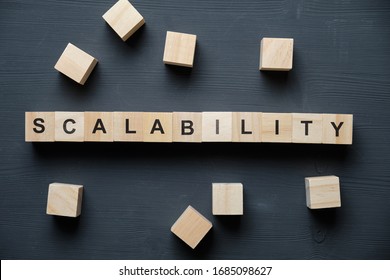 Modern business buzzword - scalability. Top view on wooden table with blocks. Top view. Close up.