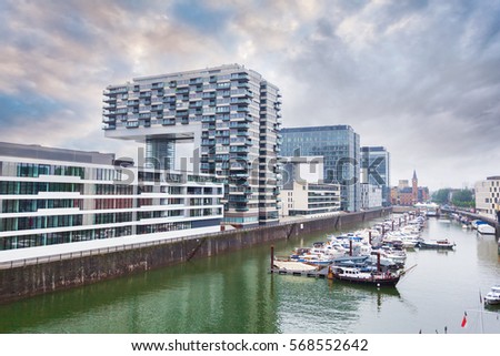 Modern business center on blue sky background in Cologne, Germany. Cologne Kranhaus - modern complex of buildings on the bank of Rhine with beautiful panoramic views in blue tones.