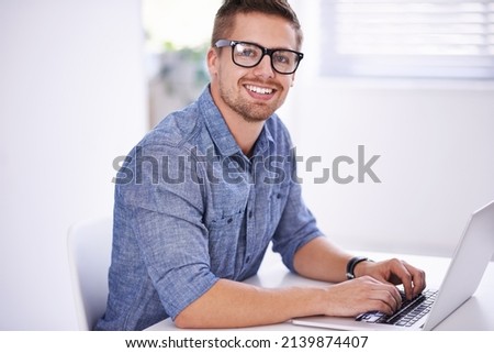 Modern business Fast-paced, innovative and online. A young creative businessman using his laptop.