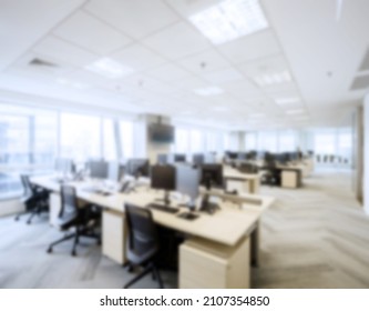 Modern Business Office Without People With Blurred Bokeh Background. Tables, Chairs, Computers. Copy Space. High Quality Photo